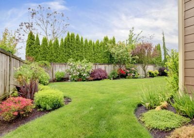 An image of a beautifully landscaped backyard
