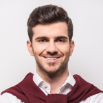 A nicely dressed man smiling