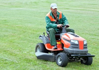 A professional mowing grass